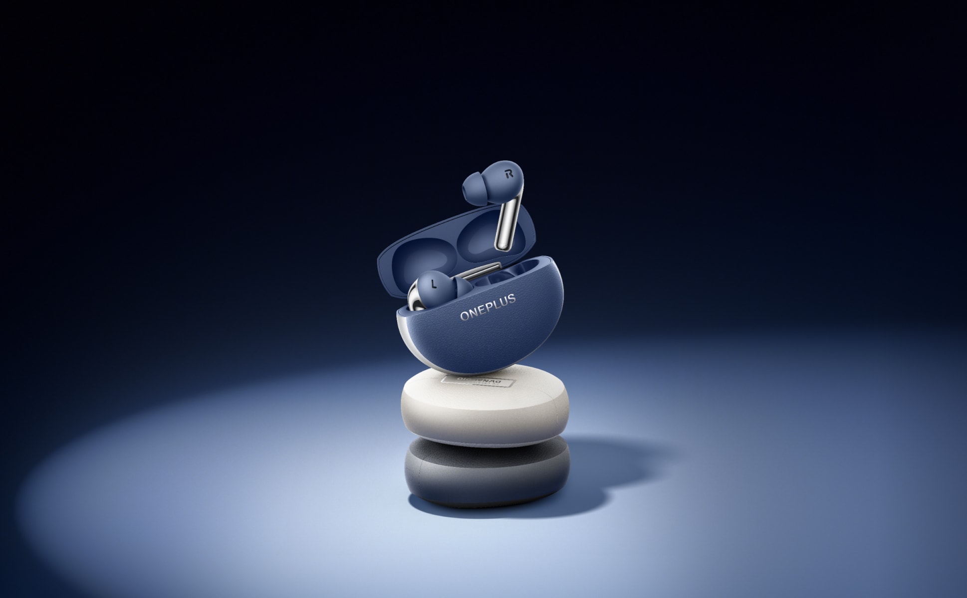 Elegant gray wireless earbuds with ergonomic design on a white stand against a dark background.
