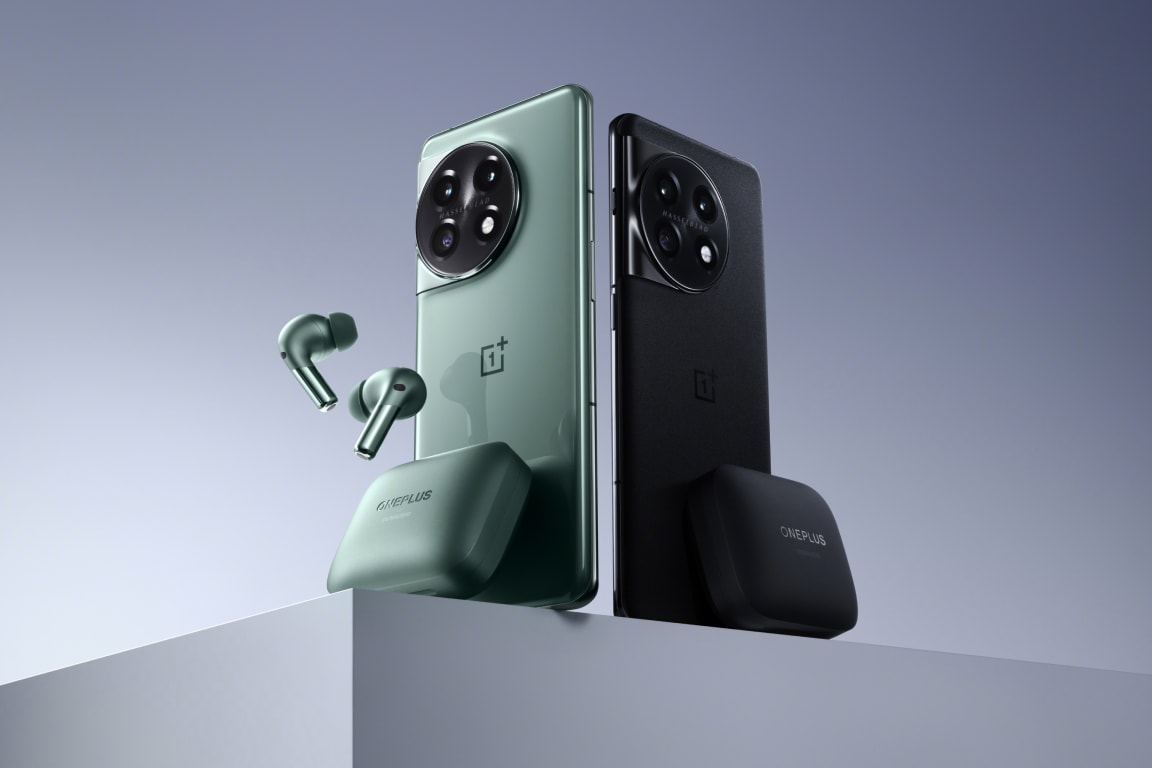 The image shows two sleek and modern OnePlus smartphones in different colors - one in a light, mint green shade and the other in a dark, matte black color. The phones have distinctive camera setups and are accompanied by a pair of matching wireless earbuds in the same light green shade. The overall design and presentation of the products suggest a premium, high-quality technological product.
