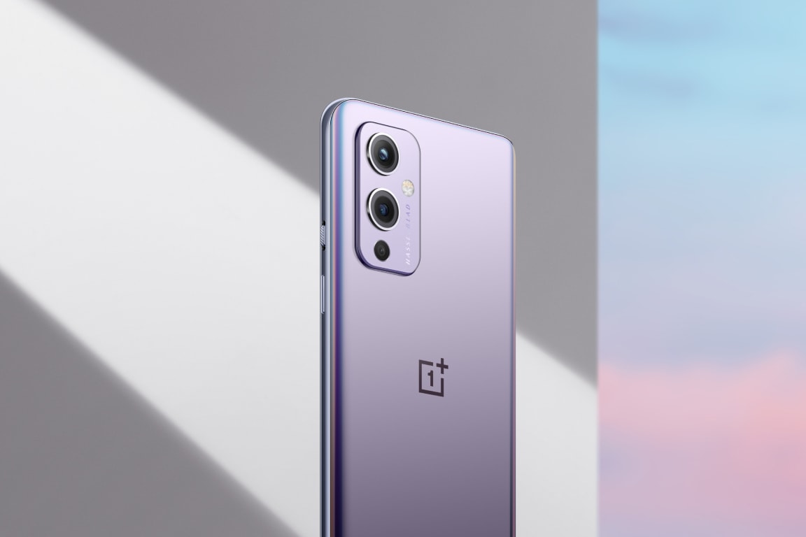Sleek silver OnePlus smartphone with multiple cameras.