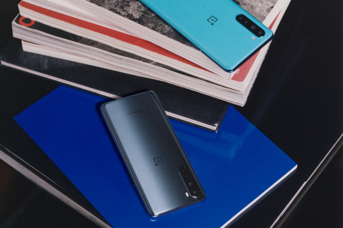 Sleek and vibrant smartphones on textured surface.